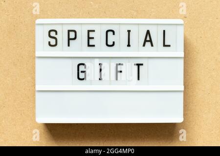 Lightbox with word special gift on wood background Stock Photo