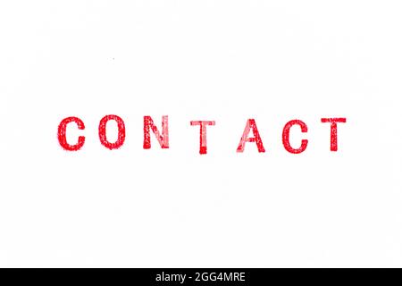 Red color rubber stamp in word contact on white paper background Stock Photo