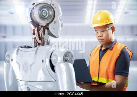 Technician or engineer work with 3d rendering robot in factory Stock Photo