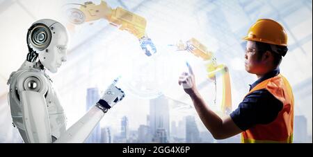 Technician or engineer work with 3d rendering robot in factory Stock Photo