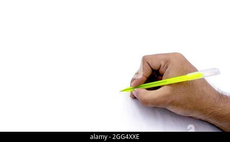 A man's hand holding pen and writing on virtual screen isolated on white background Stock Photo