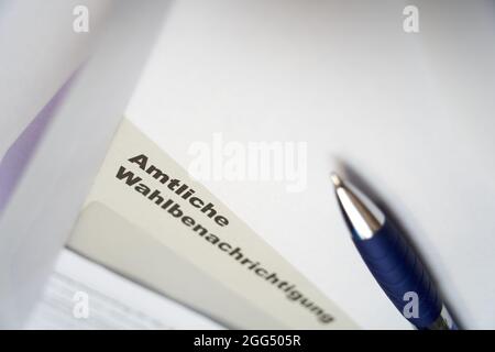 Black letters on white envelope saying: Official election notification (german: Amtliche Wahlbenachrichtigung). 2021 federal election in germany. Clos Stock Photo