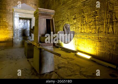 The wooden barque within the Sanctuary of Horus at the Temple of Horus at Edfu in central Egypt. It was used to carry a statue of Horus. Stock Photo