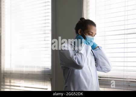 Thoughtful young male african american doctor feeling tired.