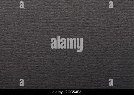 Clean matte dark black paper surface macro close up view Stock Photo