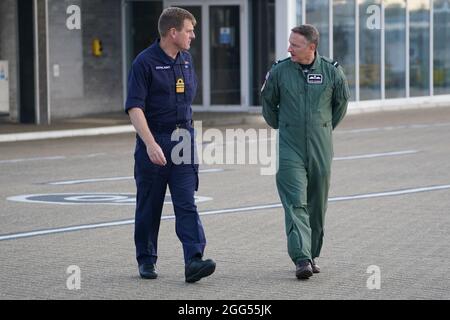 Vice-Admiral Ben Key, Chief of Joint Operations, who commands Operation Pitting (left) and Air Mobility Force Commander to Air Commodore David Manning, walk to address the media at RAF Brize Norton, Oxfordshire after the the final UK troops and diplomatic staff were airlifted from Kabul on Saturday, drawing to a close Britain's 20-year engagement in Afghanistan and a two-week operation to rescue UK nationals and Afghan allies. Picture date: Sunday August 29, 2021. Stock Photo