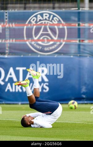Kylian Mbappe of PSG falls during a training session at the Camp des Loges Paris Saint-Germain football club's training ground in Saint-Germain-en-Laye, near Paris, France on August 28, 2021. Photo by Victor Joly/ABACAPRESS.COM Stock Photo