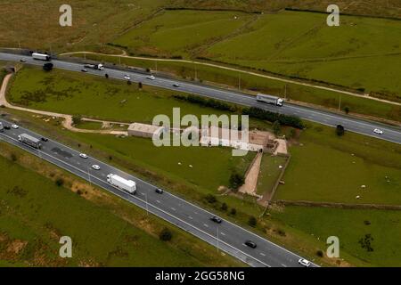 Colour Pop Aerial Image of the Famous Stott Hall Farm in the Middle of the M62 Motorway Stock Photo