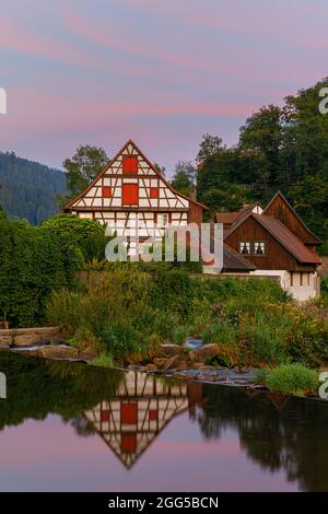 A summer sunrise with the Half-Timbered Houses in Schiltach, a town in the district of Rottweil, in Baden-Württemberg, Germany. It is situated in the Stock Photo
