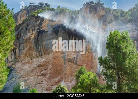 Waterfall blown by the wind on the path of the Borosa river, Sierra de Cazorla Stock Photo