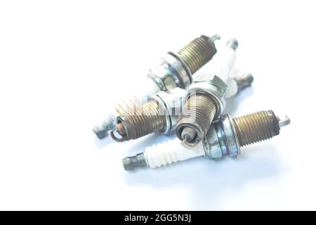 old car spark plug arranging on white background Stock Photo