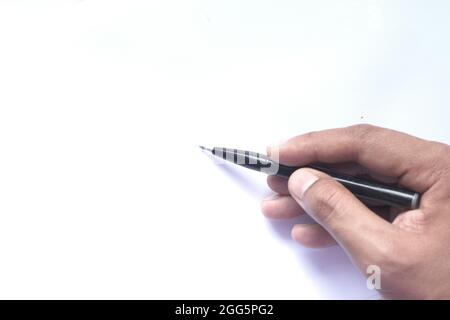 Close up of man hand writing on a white paper  Stock Photo