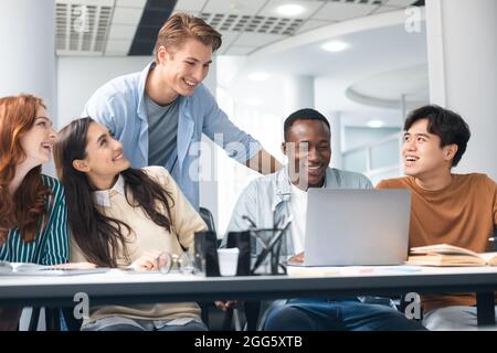 International group of people sitting at desk and using pc Stock Photo