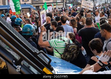 Rome Italy. August 28, 2021. Moments of tension between the police and demonstrators during the demonstration organized to protest against the health card, greenpass, in Piazza del Popolo. Credit: Cosimo Martemucci/Alamy Live News Stock Photo