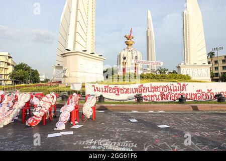 Bangkok, THAILAND - August 18, 2021: Pro-democracy protesters 'Thalufah' gather at Democracy Monument for political symbolic expression and Protest. Stock Photo