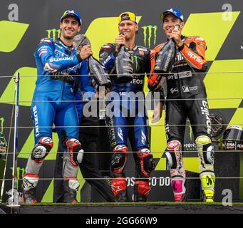 Silverstone Circuit, Silverstone, Northamptonshire, UK. 29th Aug, 2021. MotoGP British Grand Prix, Race Day; The podium riders pose with the Prosecco Credit: Action Plus Sports/Alamy Live News Stock Photo