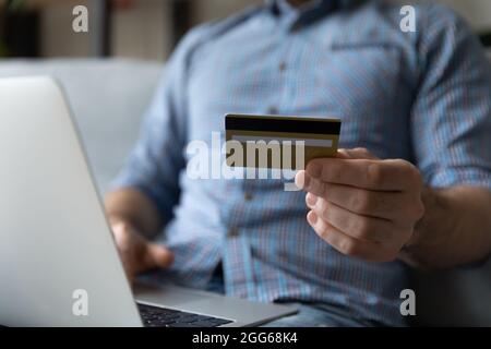 Customer using laptop and credit card for online shopping Stock Photo