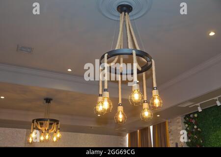 Round Hemp Rope ceiling chandelier . The Metal Cage And Rope Hanging  Contemporary Design Cafe and Home Decorative Chandelier Stock Photo - Alamy