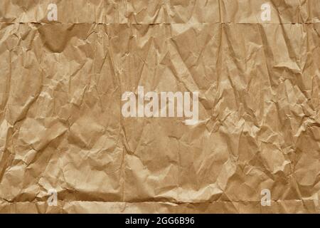 Crumpled Brown Paper Texture Background, Creased Wrapping Paper. Stock Photo