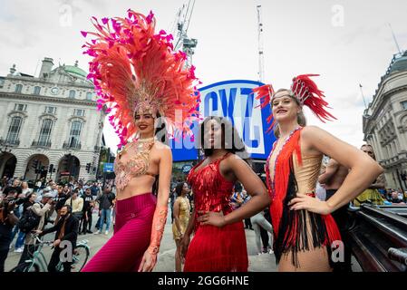 London, UK.  29 August 2021.  Samba dancers in colourful costumes take part in a flashmob around the West End organised by fashion brand RioPump GymWear.  The August Bank Holiday weekend would normally see tens of thousands of people watching events at the Notting Hill Carnival, including samba dancers, but, for the second year running, the carnival has been cancelled due to Covid-19 concerns.  Credit: Stephen Chung / Alamy Live News Stock Photo