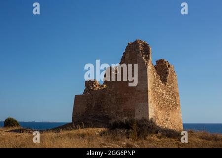 Torre Uluzzo in the Regional Park of Porto Selvaggio in Apulia At Sunset - Italy Stock Photo