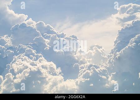 huge White fluffy cloud against  blue sky summer abstract weather background. Stock Photo