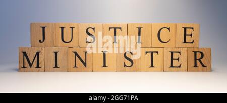 The word justice minister was created from wooden cubes. State and law Close up. Stock Photo