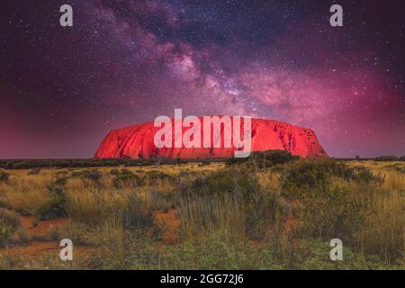 Night landscape of Uluṟu, Ayers Rock, in the Outback of the Northern Territory of Australia against a background of brilliant clear starry sky Stock Photo
