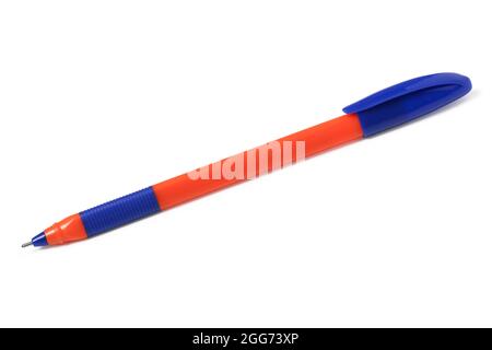 Orange plastic ballpoint pen with blue cap close up isolated on white background Stock Photo