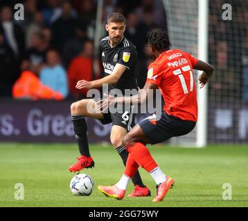 Luton, England, 28th August 2021. Chris Basham of Sheffield Utd and Pelly Ruddock Mpanzu of Luton Town  during the Sky Bet Championship match at Kenilworth Road, Luton. Picture credit should read: Simon Bellis / Sportimage Stock Photo