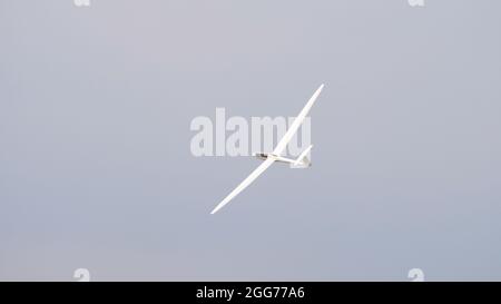 Thiene, Italy JULY, 8, 2021 Glider flying in the blue sky. High quality image with copy space. Schempp-Hirth Duo Discus Stock Photo