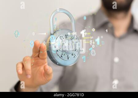 A finger touching a digital concept of security with floating padlock and binary code Stock Photo