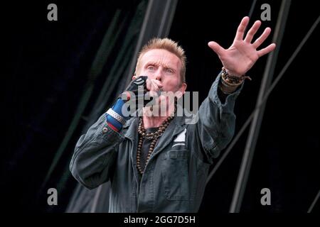 Portsmouth, UK. 28th Aug, 2021. Vocalist Rob Birch of Stereo MCs Hip hop group performs live on stage at the Victorious Festival. Credit: SOPA Images Limited/Alamy Live News Stock Photo