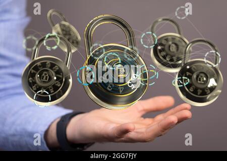 A digital concept of security with floating padlocks on a hand Stock Photo