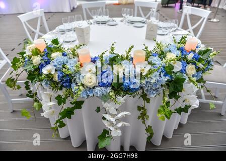 Beautiful floral composition on the festive table for the wedding party Stock Photo