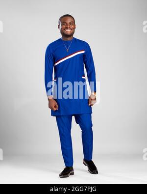 young african man dressed in stylish native attire smiling Stock Photo