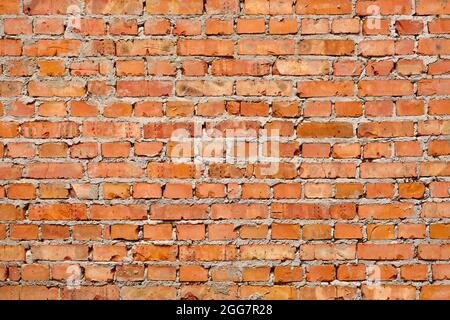 Red brick pattern wall background material. Masonry construction stone texture brick wall loft background. Brickwork background brick building wall Stock Photo