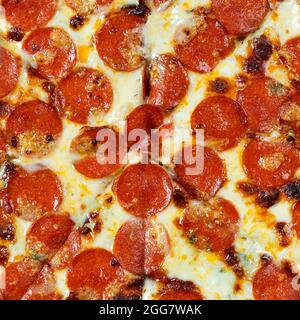 Close up view on Tasty paperoni pizza. Top view on paperoni pizza. Concept for italian food, street food, fast food, quick bite. Stock Photo