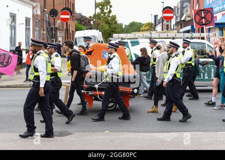 Police Life Raft Police surround an inflatable life raft on a cart as its pulled along ...