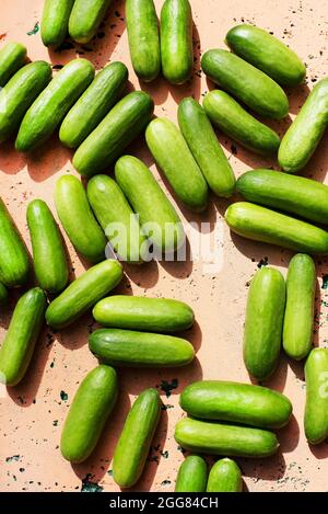 Overhead view of cucumbers on concrete surface Stock Photo