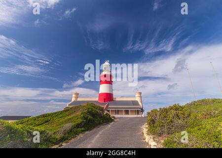 Cape Agulhas Lighthouse which is the second oldest still operating lighthouse in South Africa that also located at the Southernmost Point of Africa. Stock Photo