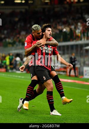 Milan. 30th Aug, 2021. AC Milan's Sandro Tonali celebrates his goal with his teammate Theo Hernandez during a Serie A football match between AC Milan and Cagliari in Milan, Italy, on Aug 29, 2021. Credit: Xinhua/Alamy Live News Stock Photo