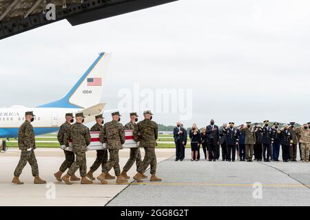Dover, United States Of America. 29th Aug, 2021. U.S President Joe Biden, First Lady Jill Biden and Defense Secretary Lloyd Austin III salute during the transfers of the remains of Marine Corps Lance Cpl. Jared M. Schmitz at Dover Air Force Base August 29, 2021 in Dover, Delaware. The remains of 11 Marines, a Navy medic and an Army staff sergeant, killed in Afghanistan were airlifted home. Credit: Planetpix/Alamy Live News