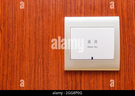 Electrical white led light on wooden wall for room check out notification. Stock Photo