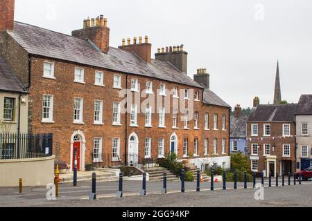 26 August 2021 A row of beautiful Georgian terraced houses located in The Square in the Royal Trust village of Hilsborough in County Down Northern Ire Stock Photo