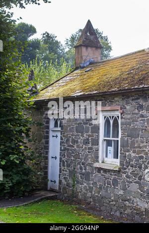 26 August 2021 The side of the Sexton's building at the gateway to grounds of St Malachy's Parish Church in Hillsborough a village with Royal status i Stock Photo