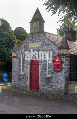 26 August 2021 The Sexton's building at the gateway to grounds of St Malachy's Parish Church in Hillsborough a village with Royal status in County Dow Stock Photo