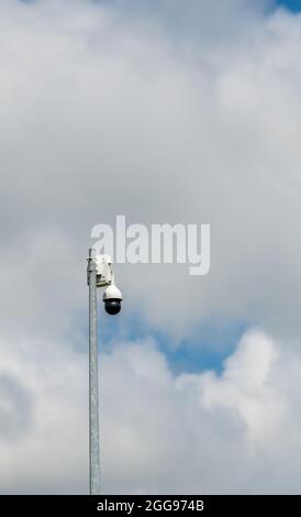 surveillance camera on a pole in the street Stock Photo