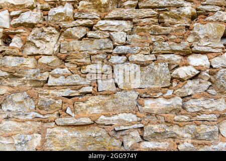 Old stonewall for background or texture Stock Photo