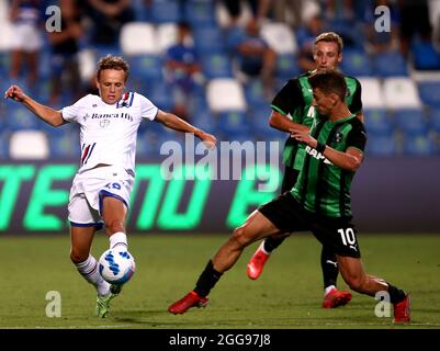 REGGIO NELL'EMILIA, ITALY - AUGUST 29: Filip Djuricic of US Sassuolo competes for the ball with Mikkel Damsgaard of UC Sampdoria ,during the Serie A match between US Sassuolo and UC Sampdoria at Mapei Stadium - Citta' del Tricolore on August 29, 2021 in Reggio nell'Emilia, . (Photo by MB Media) Stock Photo